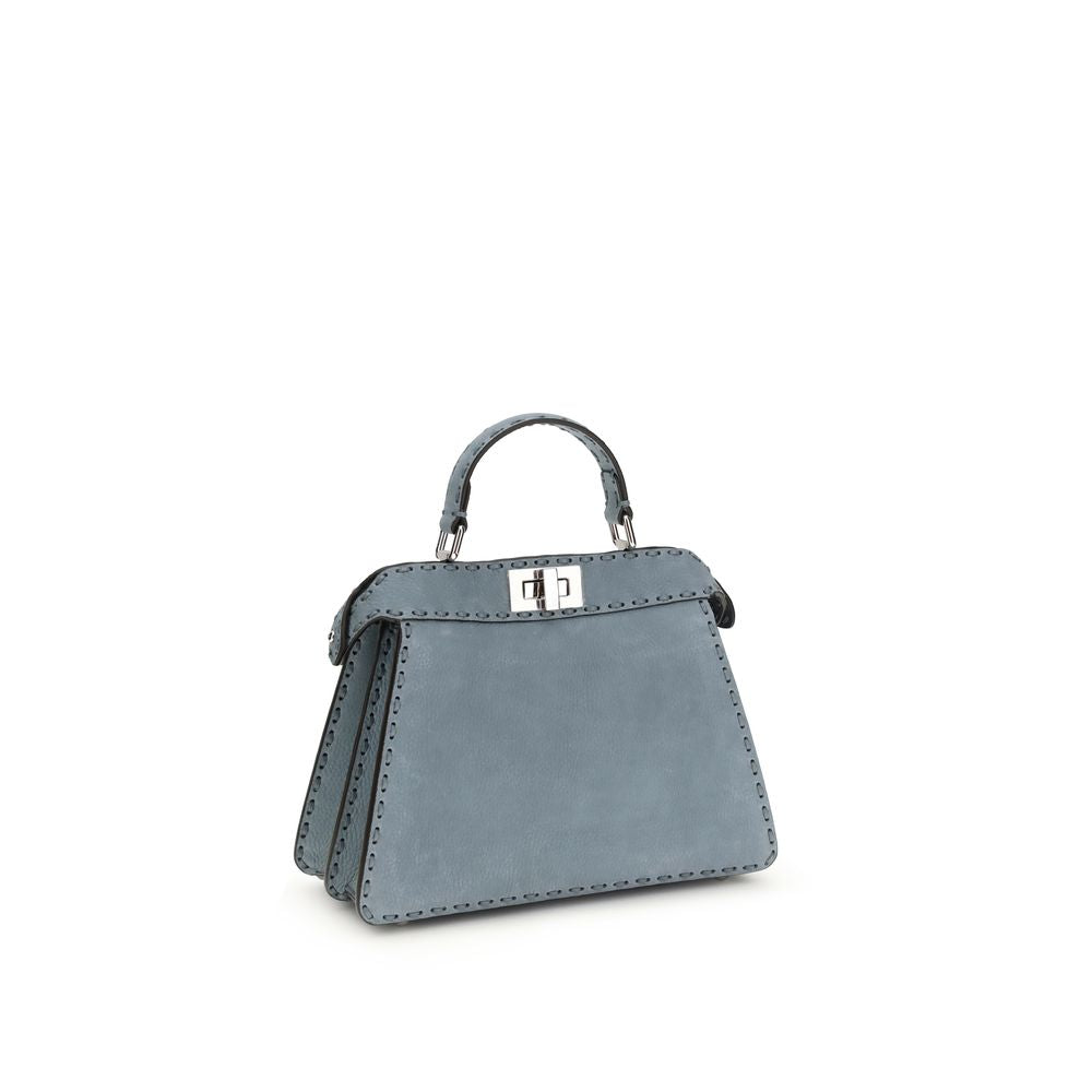 Experience the allure of the Fendi Light Blue Calf Leather Bos Taurus Handbag, a masterpiece of artisanal luxury that embodies elegance and sophistication for every occasion.
