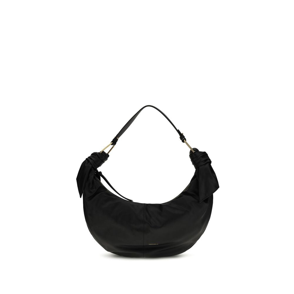 Discover the Coccinelle Black Calf Leather Bos Taurus Shoulder Bag, a masterpiece of exquisite craftsmanship and timeless elegance, perfect for the discerning individual.