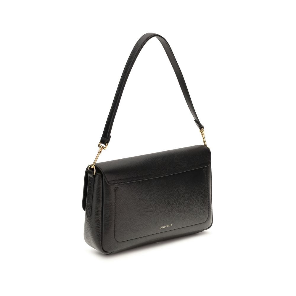 Indulge in the Coccinelle Black Calf Leather Bos Taurus Shoulder Bag, a masterpiece of craftsmanship and elegance, perfect for the discerning individual seeking timeless luxury.