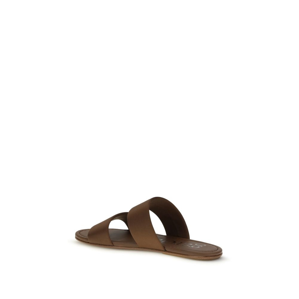 Step into the allure of Pedro García's Brown Silk Flat Sandals, where luxurious silk meets refined craftsmanship, perfect for elevating your sophisticated style.