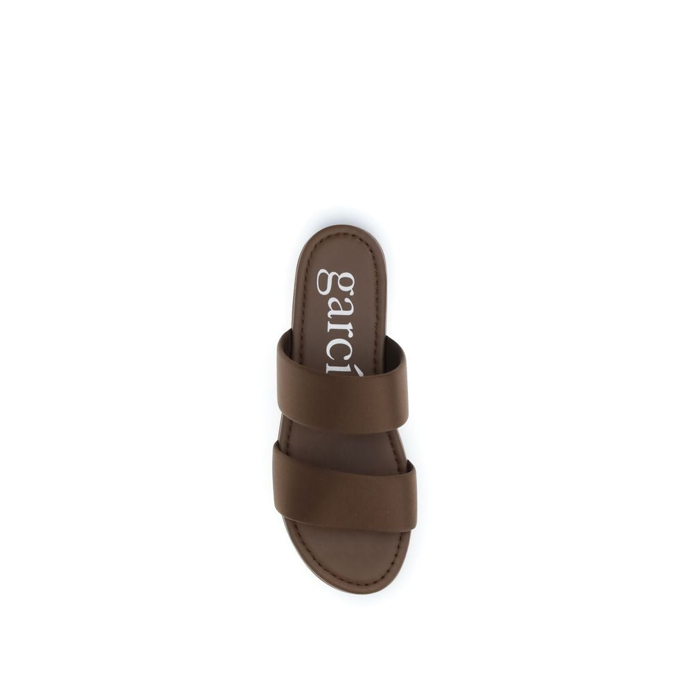 Experience the exquisite elegance of Pedro García Brown Silk Flat Sandals, crafted from luxurious silk and calf leather, perfect for elevating any refined ensemble.