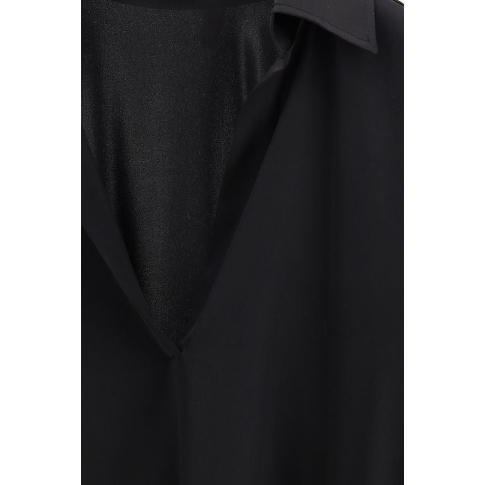 Experience the epitome of elegance with the Tom Ford Black Silk Dress Shirt, crafted from luxurious silk and elastane for a refined silhouette that captivates.