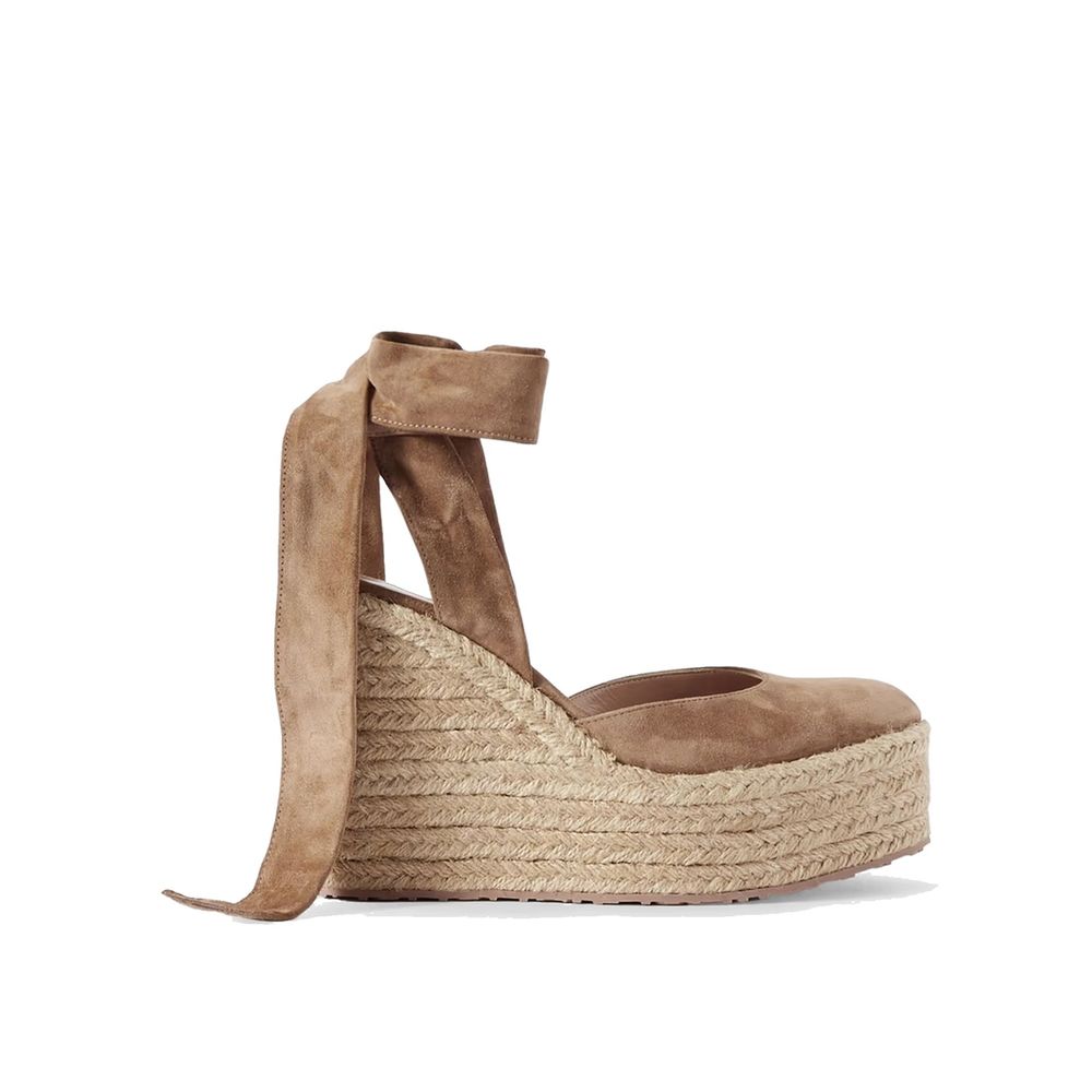 Indulge in the exquisite Gianvito Rossi Beige Calfskin Espadrilles, where artisanal craftsmanship meets timeless elegance, elevating your sophisticated style effortlessly.