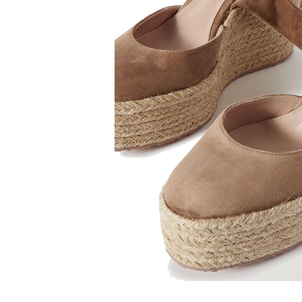 Indulge in the exquisite Gianvito Rossi Beige Calfskin Espadrilles, where artisanal luxury meets timeless elegance, elevating your style with unparalleled sophistication.