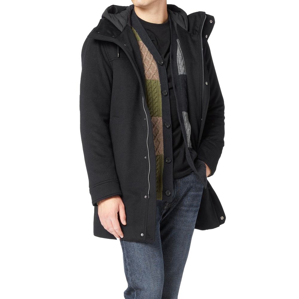 Indulge in the exquisite Herno Black Cashmere Coat, a masterpiece of craftsmanship blending cashmere and wool, designed for those who embody timeless elegance and sophistication.
