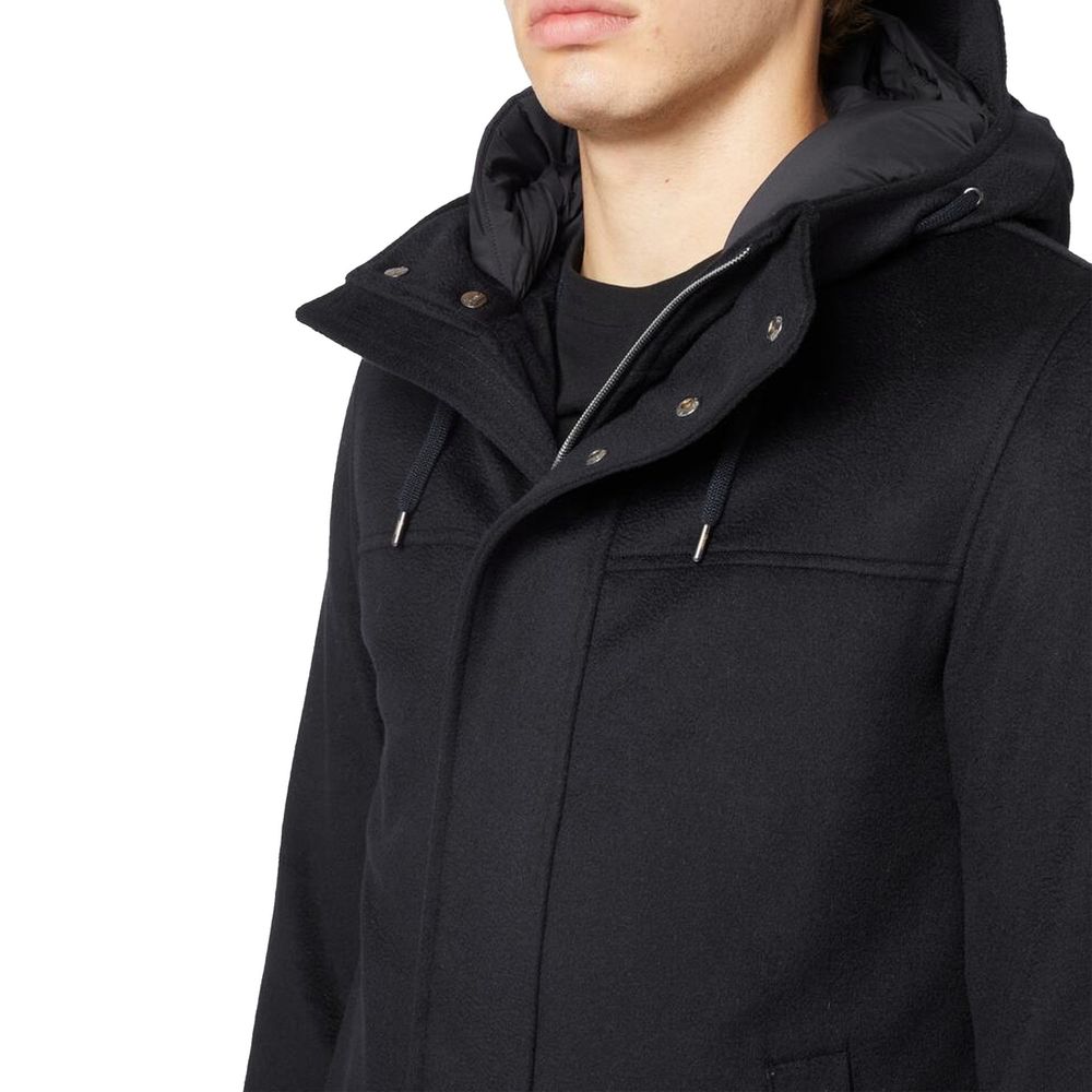 Discover the Herno Black Cashmere Coat, a masterful blend of 10% cashmere and 90% wool, embodying sophistication and timeless elegance for the discerning individual.