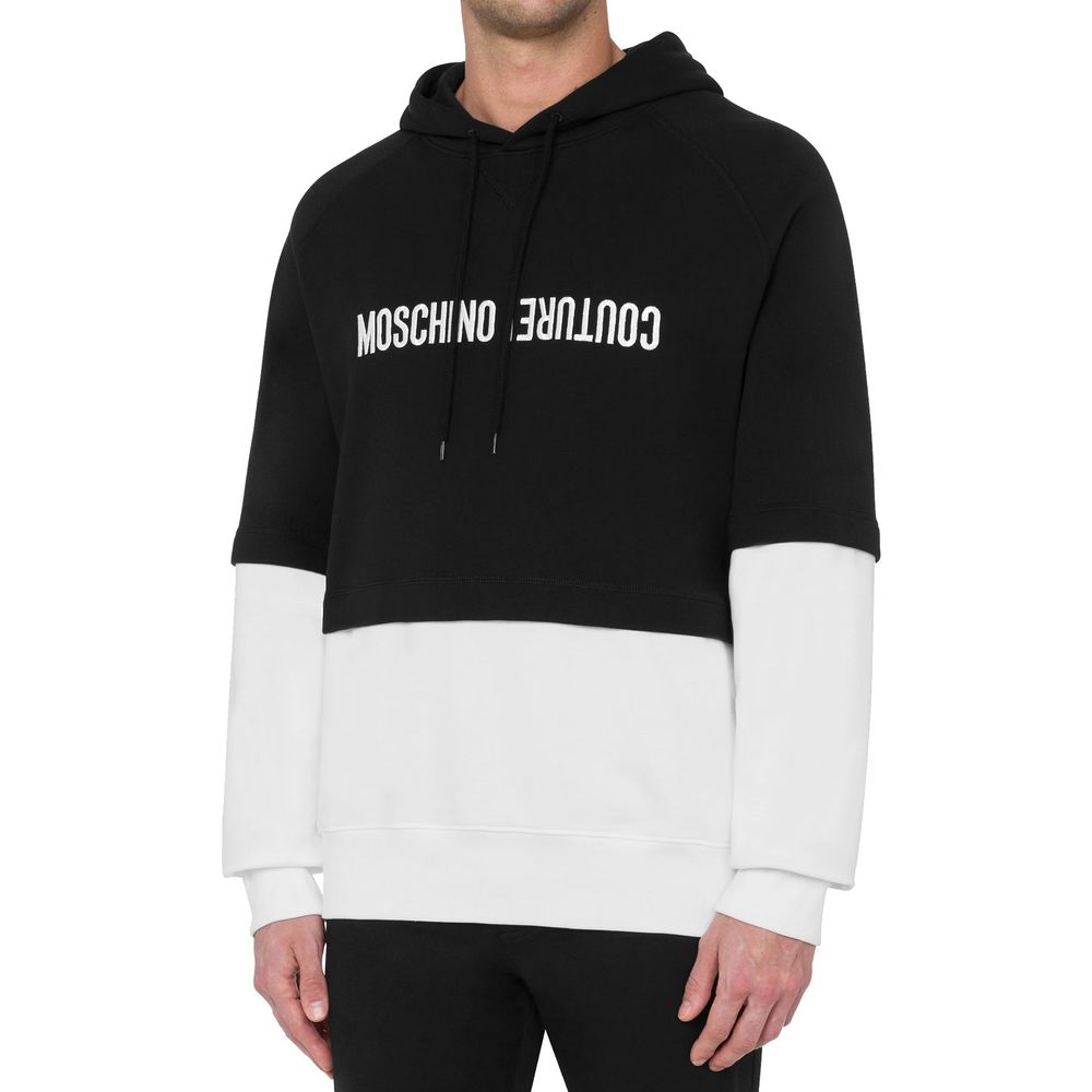 Discover the Moschino Black Cotton Sweatshirt, a blend of luxurious comfort and sophisticated design, perfect for those who embody elegance and confidence.