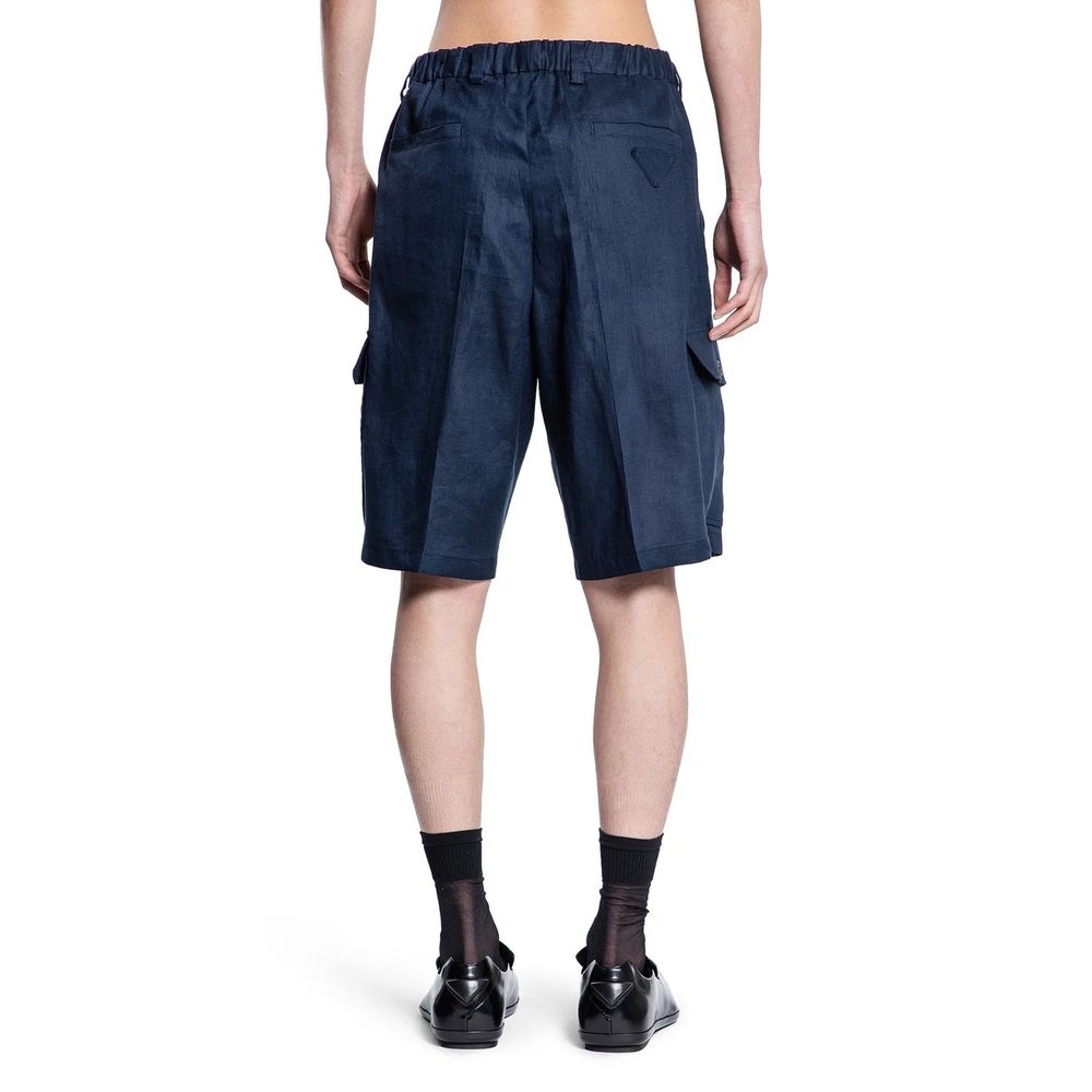 Experience the allure of Prada Blue Linen Bermuda Shorts, crafted from 100% linen for unmatched elegance and comfort, perfect for those who embody sophistication.