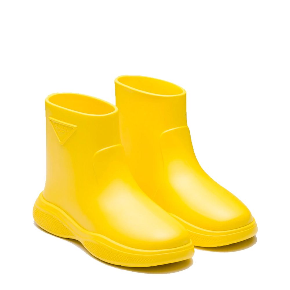 Elevate your rainy-day elegance with Prada Bicolor Rubber Rain Boots, where exquisite Italian craftsmanship meets luxurious functionality for the discerning individual.