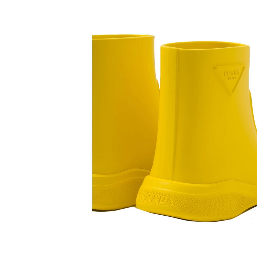Elevate your rainy day elegance with Prada Bicolor Rubber Rain Boots, where artisanal craftsmanship meets luxurious design for the discerning individual.