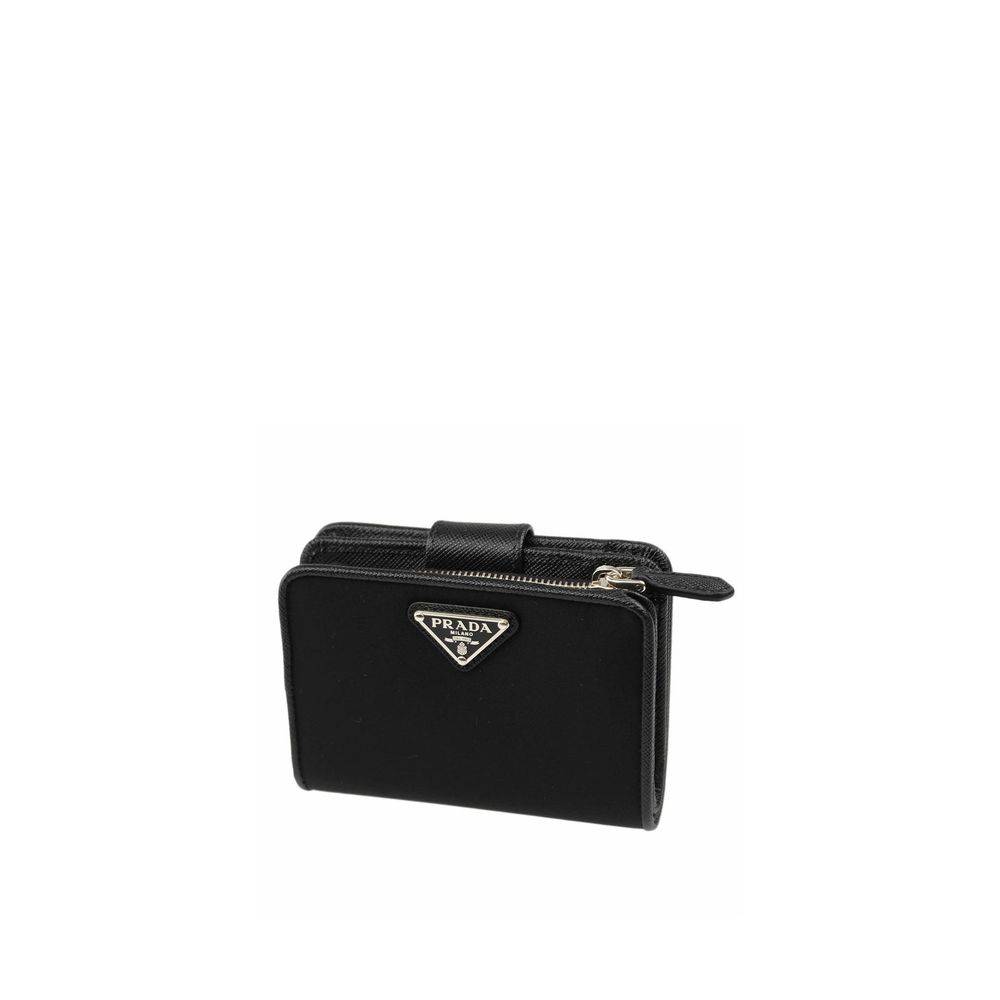 Indulge in the Prada Black Nylon Wallet, a masterpiece of 100% nylon and leather detailing, embodying timeless elegance and sophistication for the discerning individual.