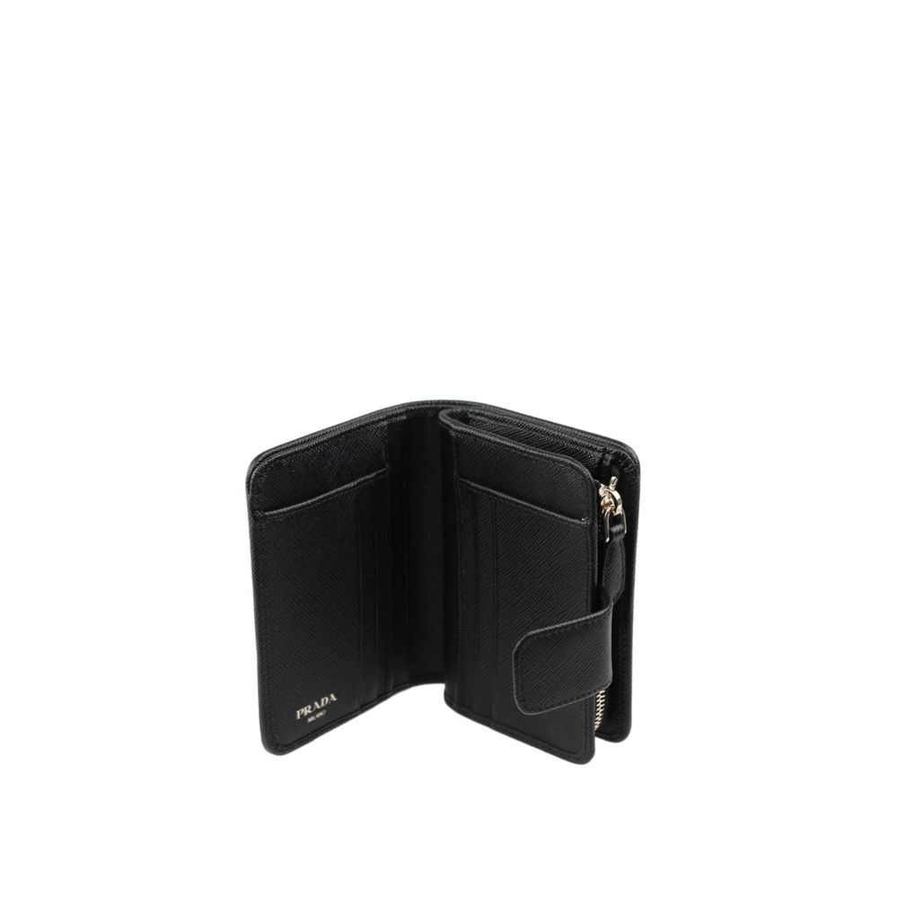 Indulge in the Prada Black Nylon Wallet, a masterpiece of 100% nylon and leather detailing, embodying timeless elegance and sophistication for the discerning individual.