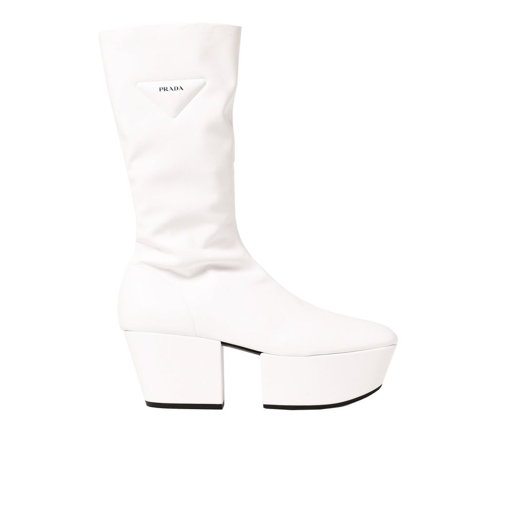 Elevate your style with Prada White Polyethylene Boots, crafted from luxurious polyurethane, merging timeless elegance with modern sophistication for discerning tastes.