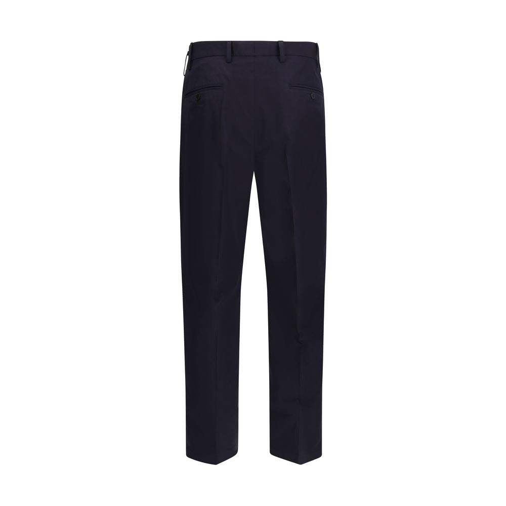 Elevate your wardrobe with the Prada Blue Cotton Dress Pants, crafted from luxurious cotton poplin, embodying sophistication and timeless elegance for the discerning individual.
