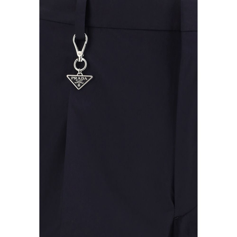 Elevate your wardrobe with Prada Blue Cotton Dress Pants, crafted from luxurious cotton poplin, embodying timeless elegance and meticulous craftsmanship for the discerning individual.