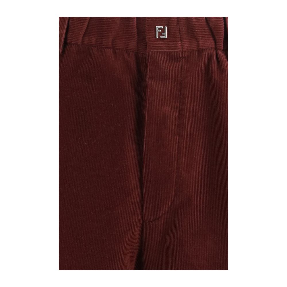 Indulge in the Fendi Bordeaux Cotton Casual Pants, crafted from sumptuous ribbed velvet, embodying timeless elegance and sophistication for the discerning fashion connoisseur.