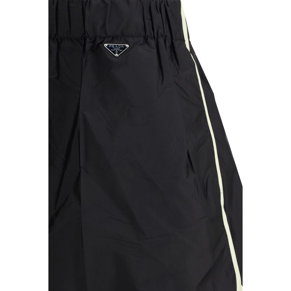 Discover the Prada Black Recycled Polyamide Bermuda Shorts, a fusion of sustainable luxury and timeless elegance, crafted for the discerning individual who values both style and conscience.