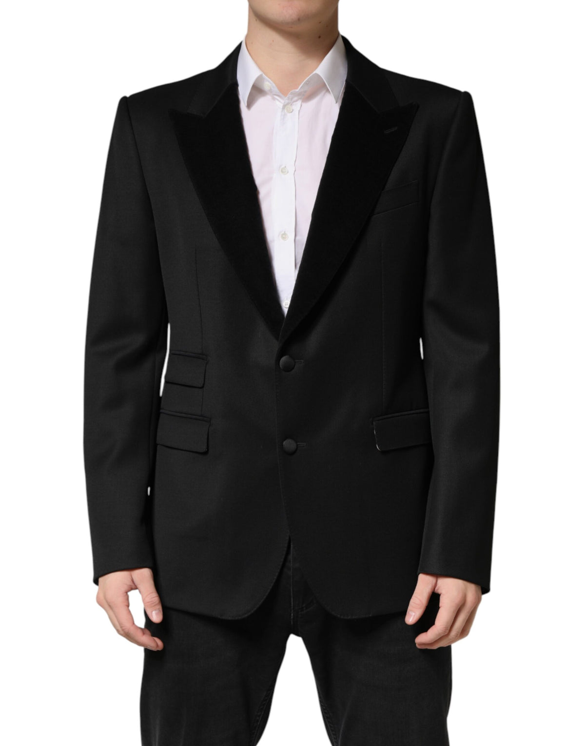 Elevate your wardrobe with the Dolce & Gabbana Black Wool Single Breasted Blazer, a timeless piece crafted from luxurious materials, embodying sophistication and Italian artistry.