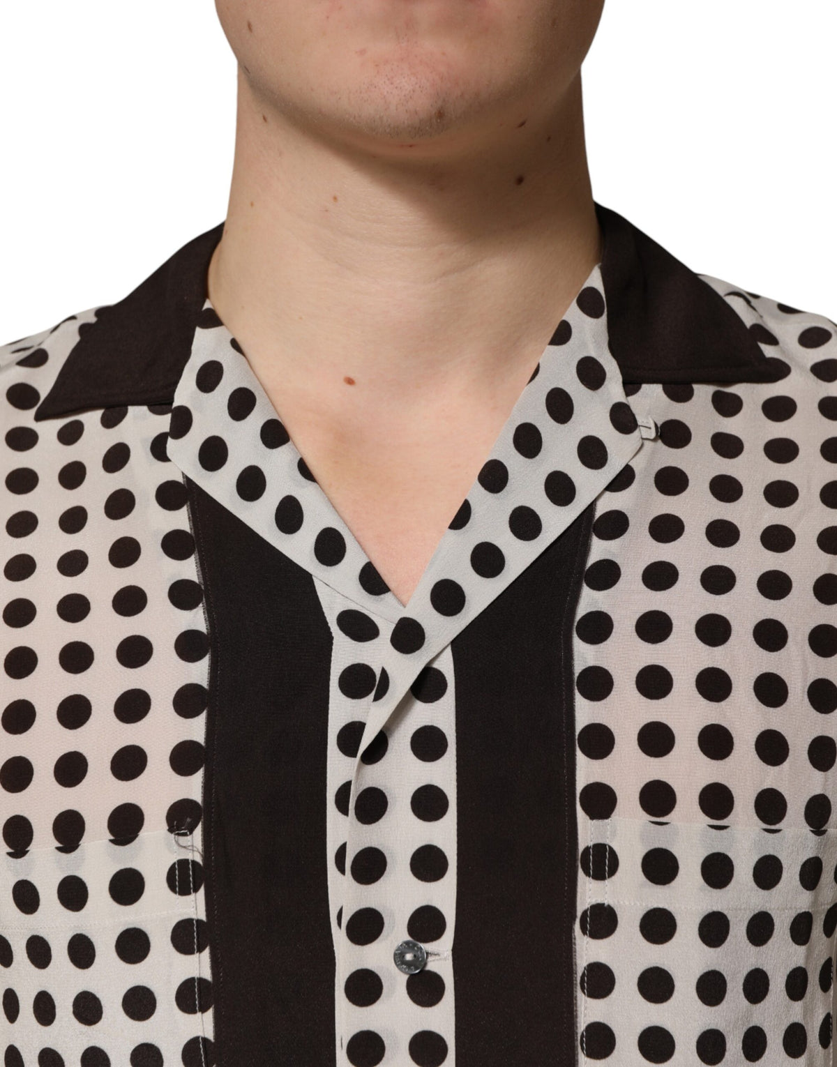 Elevate your style with the Dolce & Gabbana White Black Polka Dot Silk Casual Shirt, a masterpiece of Italian craftsmanship that embodies luxury and sophistication for any occasion.