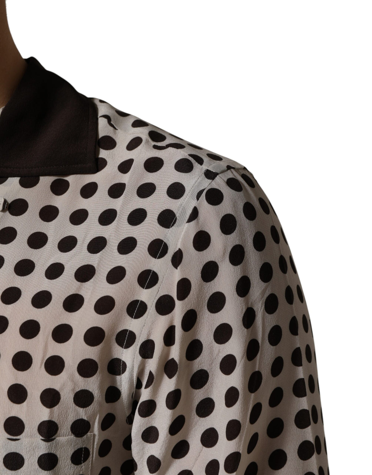Elevate your style with the Dolce & Gabbana White Black Polka Dot Silk Casual Shirt, a masterpiece of Italian craftsmanship that embodies luxury and sophistication for every occasion.
