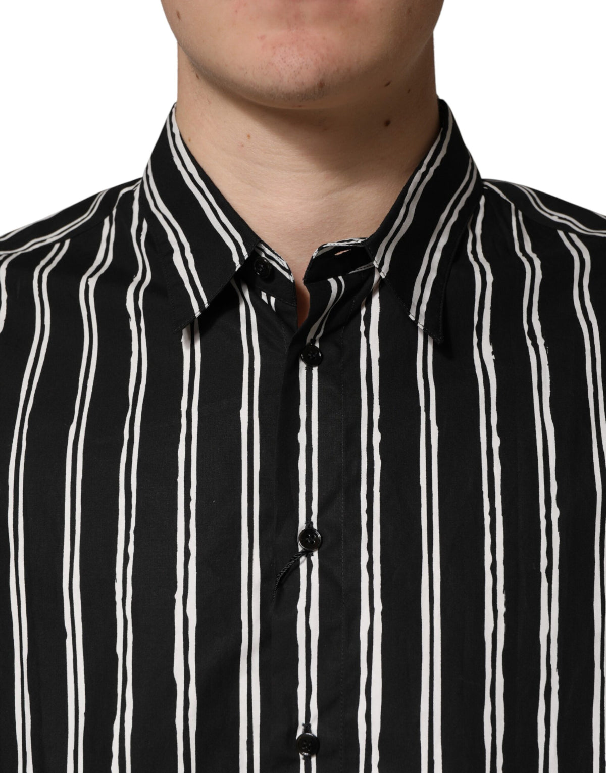 Discover the Dolce & Gabbana Black Stripes Cotton Dress Shirt, a masterpiece of Italian craftsmanship that elevates your wardrobe with timeless elegance and sophistication.