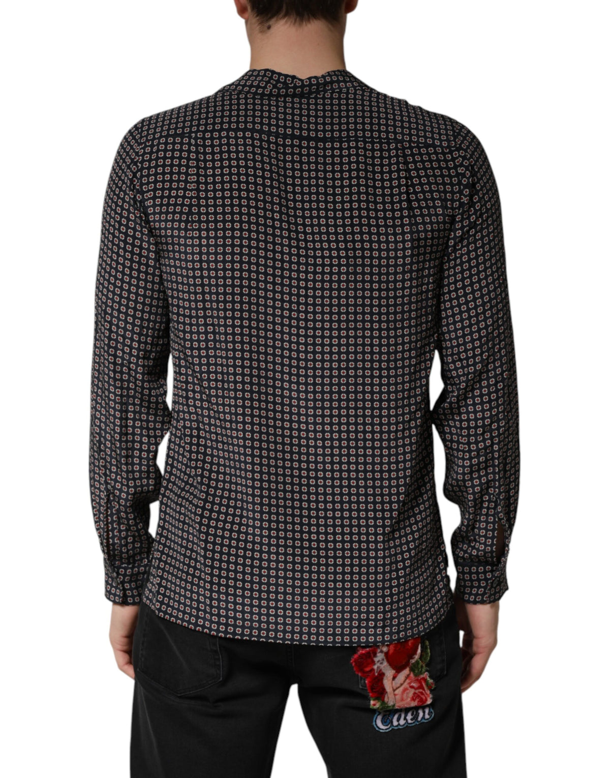 Indulge in the exquisite allure of the Dolce & Gabbana Black Patterned Silk Men Button Down Shirt, a testament to Italian craftsmanship and timeless elegance, perfect for the discerning individual.