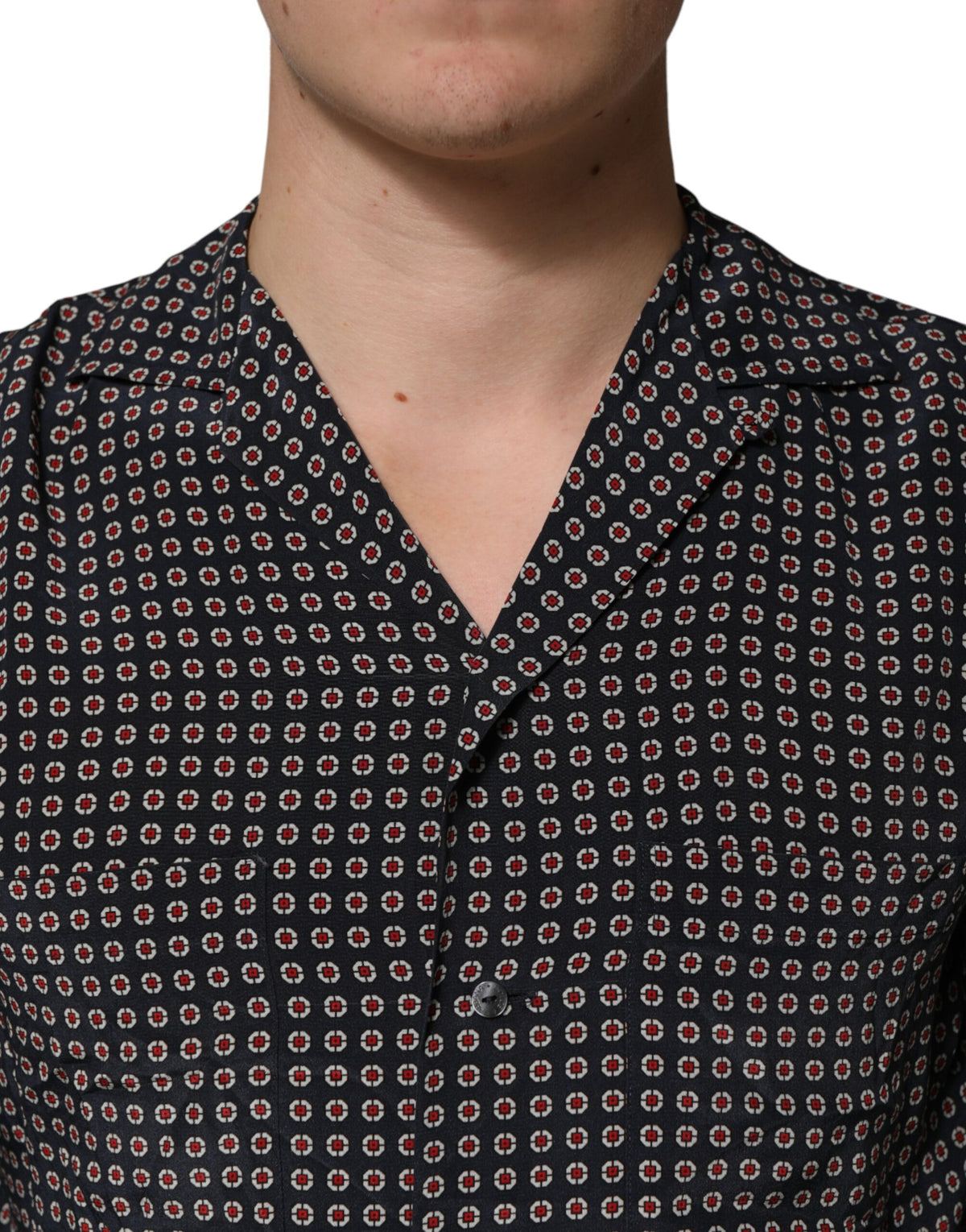 Indulge in the exquisite craftsmanship of the Dolce & Gabbana Black Patterned Silk Button Down Shirt, a timeless piece that elevates your style with luxurious silk and sophisticated design.