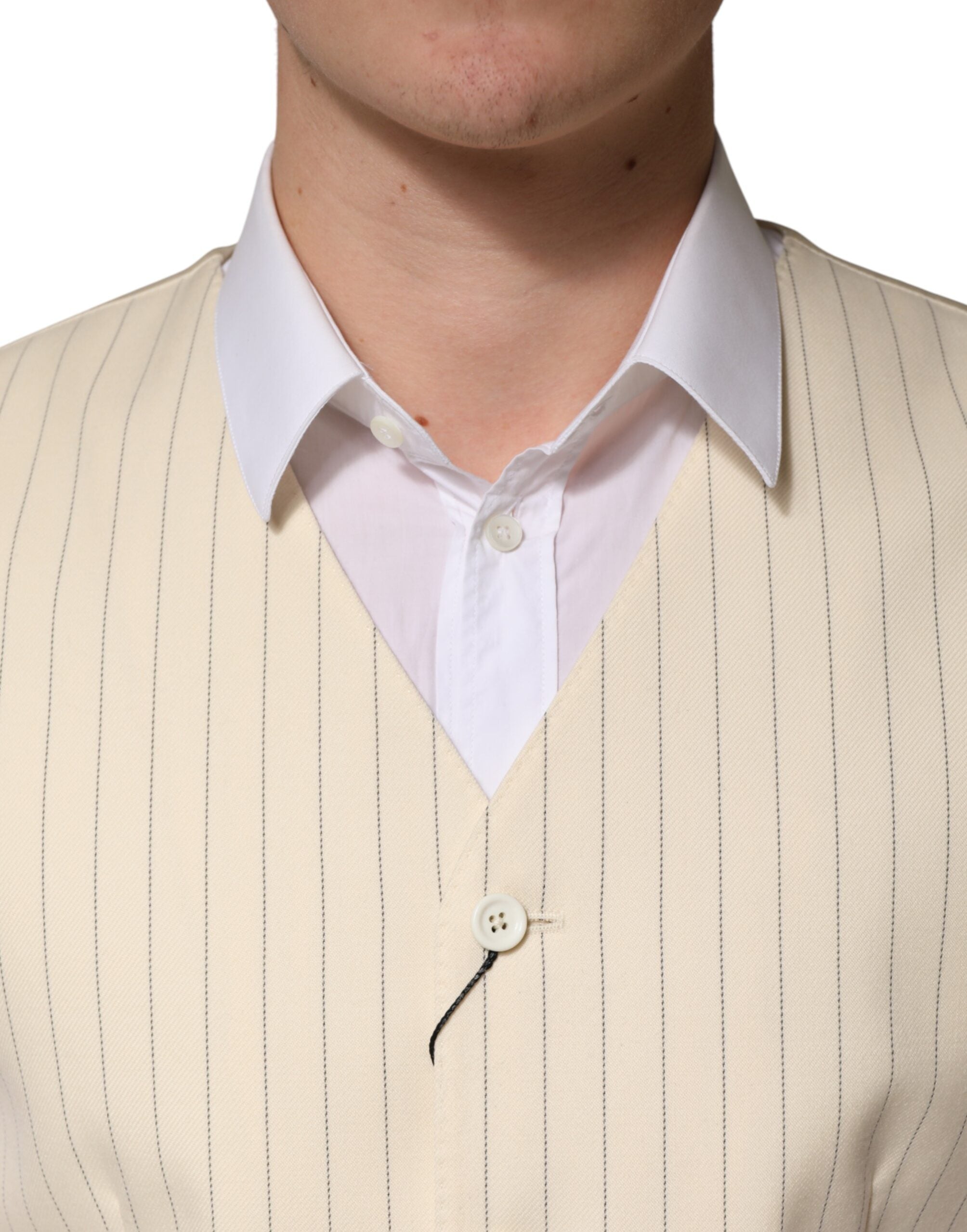 Elevate your wardrobe with the Dolce & Gabbana Beige Stripes Wool Waistcoat, a masterpiece of Italian craftsmanship in luxurious virgin wool, perfect for discerning tastes.