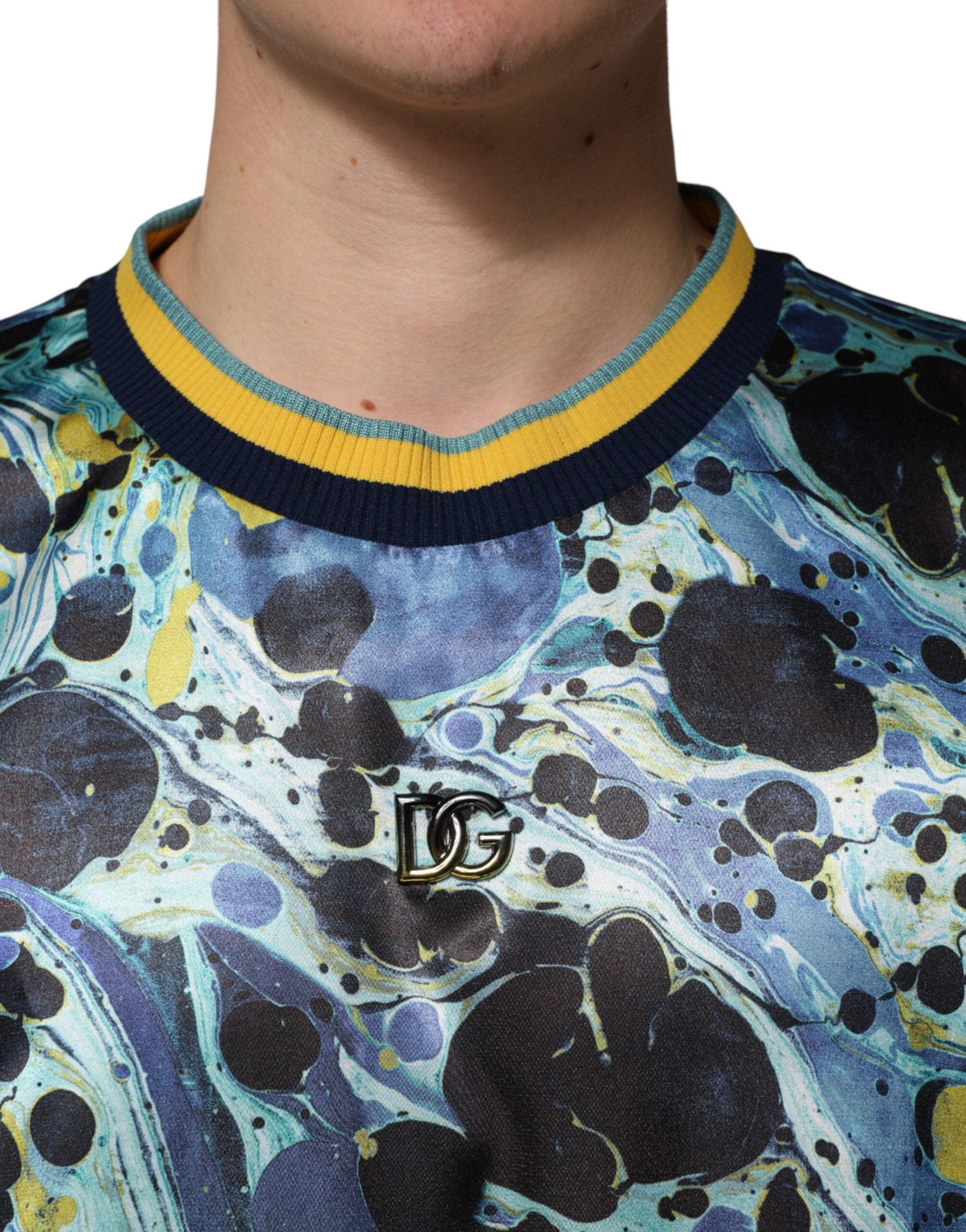 Indulge in the exquisite Dolce & Gabbana Multicolor Marble Print Pullover Sweater, a masterpiece of Italian craftsmanship blending luxurious polyester and elastane for effortless elegance.