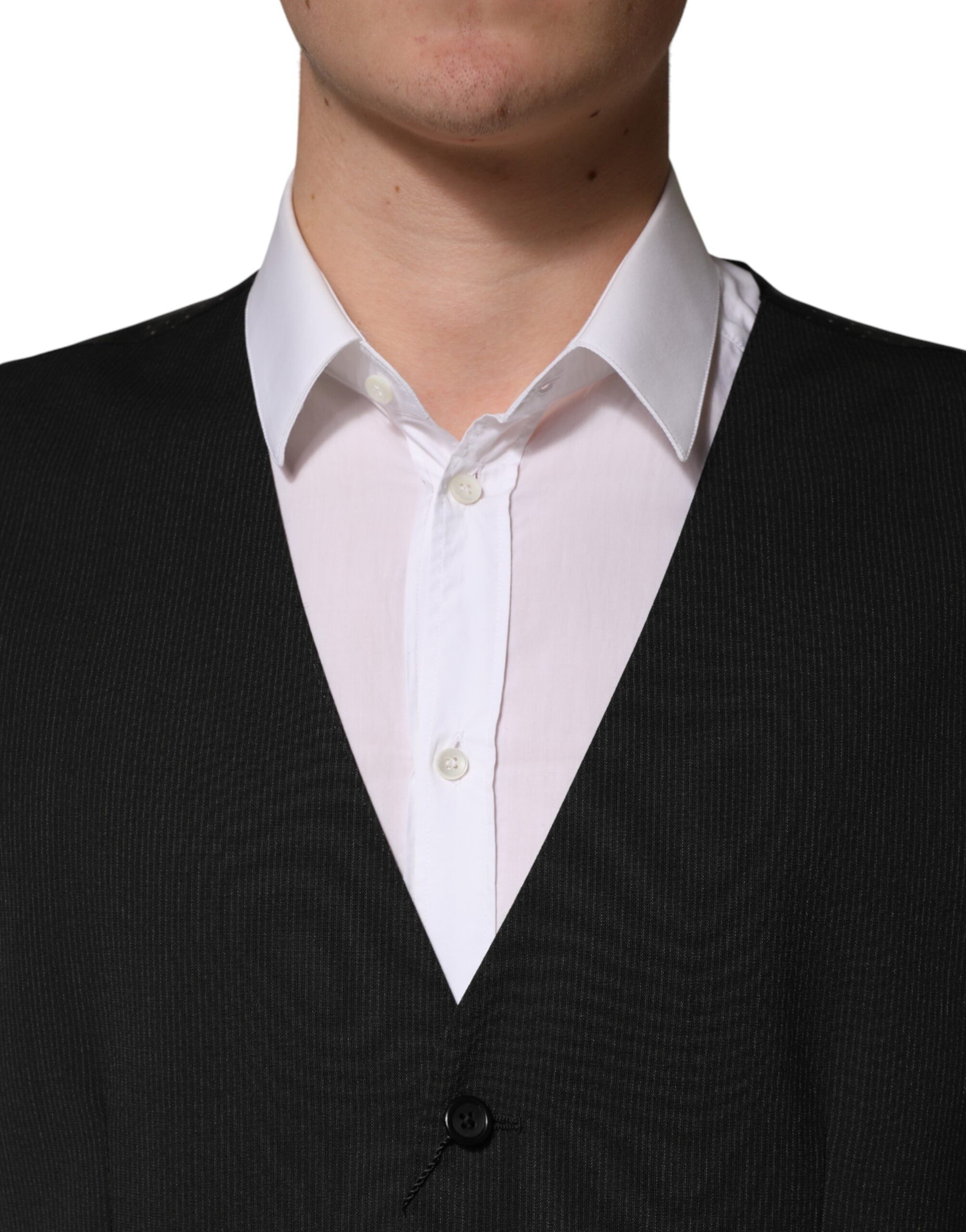Discover the Dolce & Gabbana Black Wool Dress Waistcoat Vest, a masterpiece of Italian craftsmanship in luxurious virgin wool, perfect for elevating your formal attire with timeless elegance.