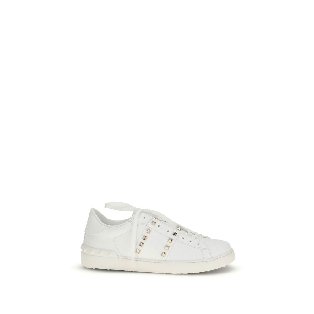 Discover the exquisite elegance of Valentino Garavani's White Calf Leather Bos Taurus Low Top Sneakers, where artisanal craftsmanship meets modern sophistication for the discerning individual.