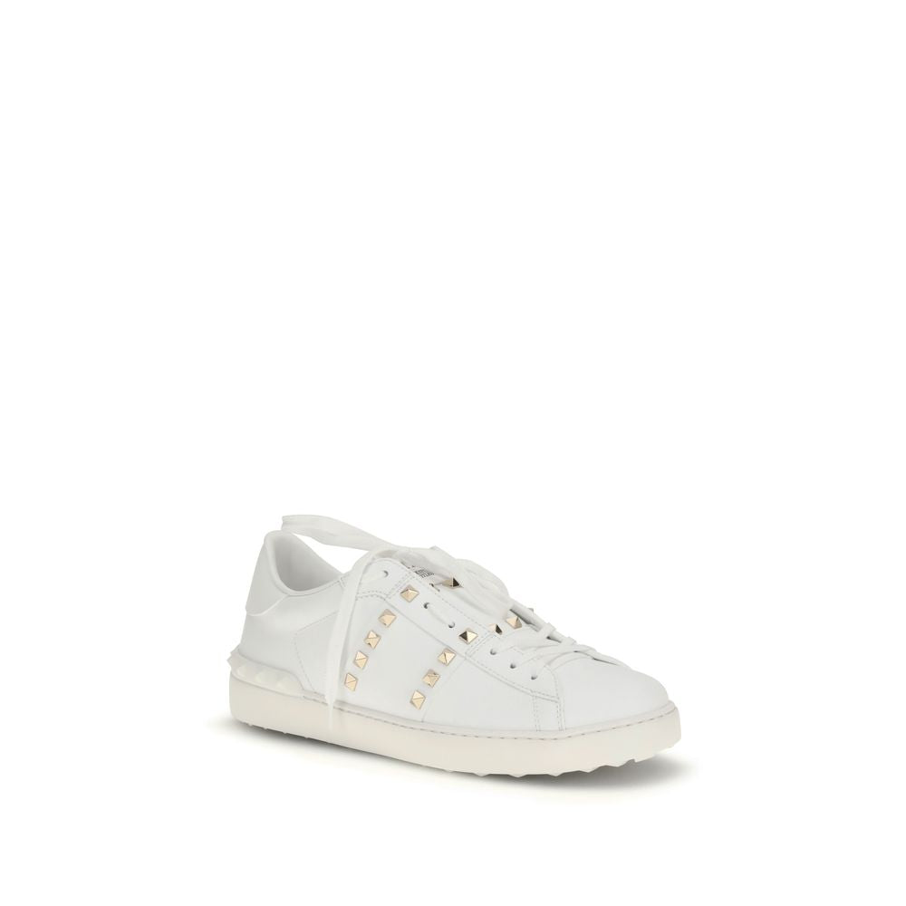 Discover the exquisite Valentino Garavani White Calf Leather Bos Taurus Low Top Sneakers, where artisanal craftsmanship meets modern elegance for those who embody sophistication.