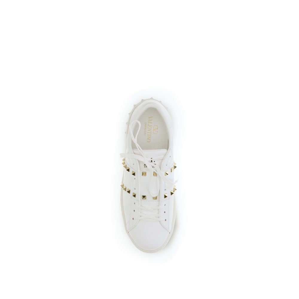 Indulge in the luxurious elegance of Valentino Garavani's White Calf Leather Bos Taurus Low Top Sneakers, where exquisite craftsmanship meets modern sophistication for the discerning individual.