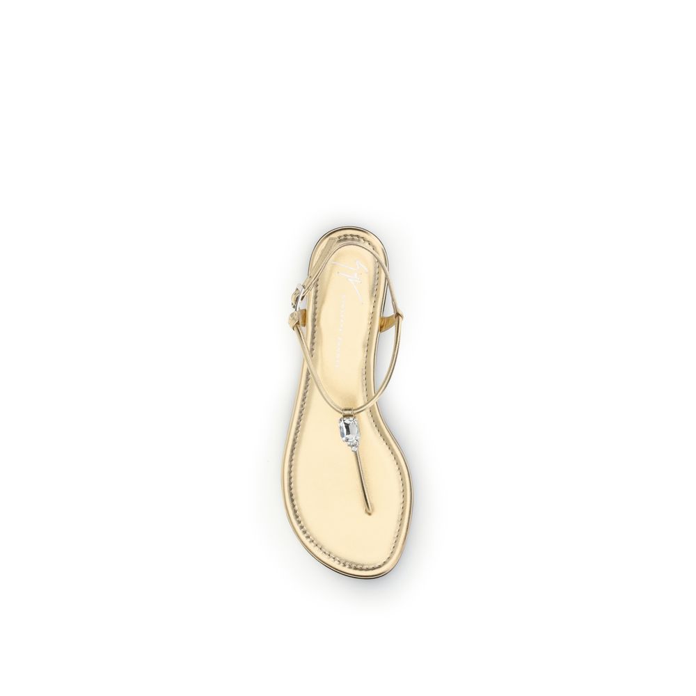 Indulge in the exquisite Giuseppe Zanotti Gold Calf Leather Bos Taurus Flat Sandals, where Italian craftsmanship meets luxurious comfort, perfect for every discerning occasion.