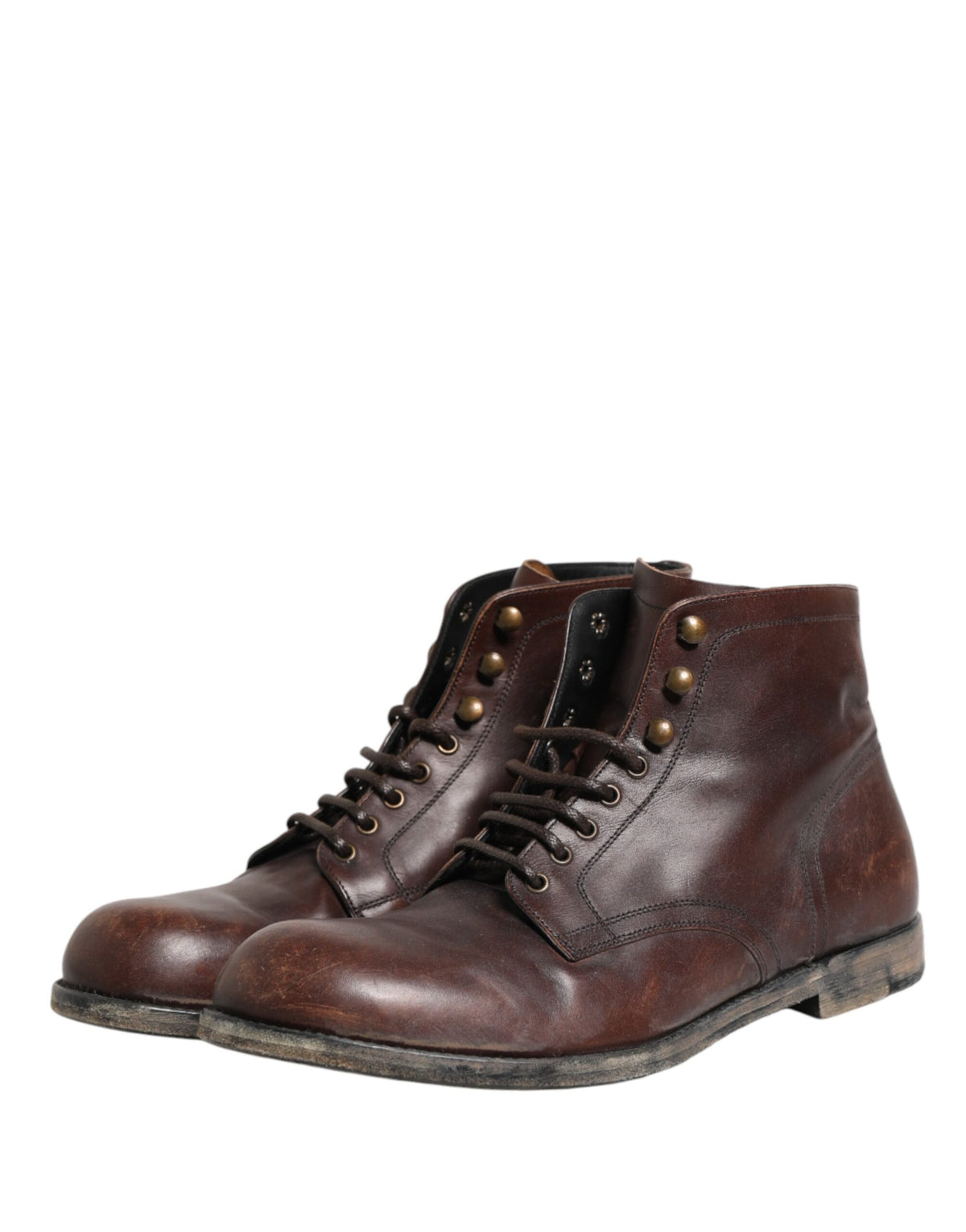 Step into a realm of sophistication with Dolce & Gabbana's Brown Lace Up Short Ankle Boots, crafted from premium leather in Italy, embodying timeless elegance and artisanal luxury.