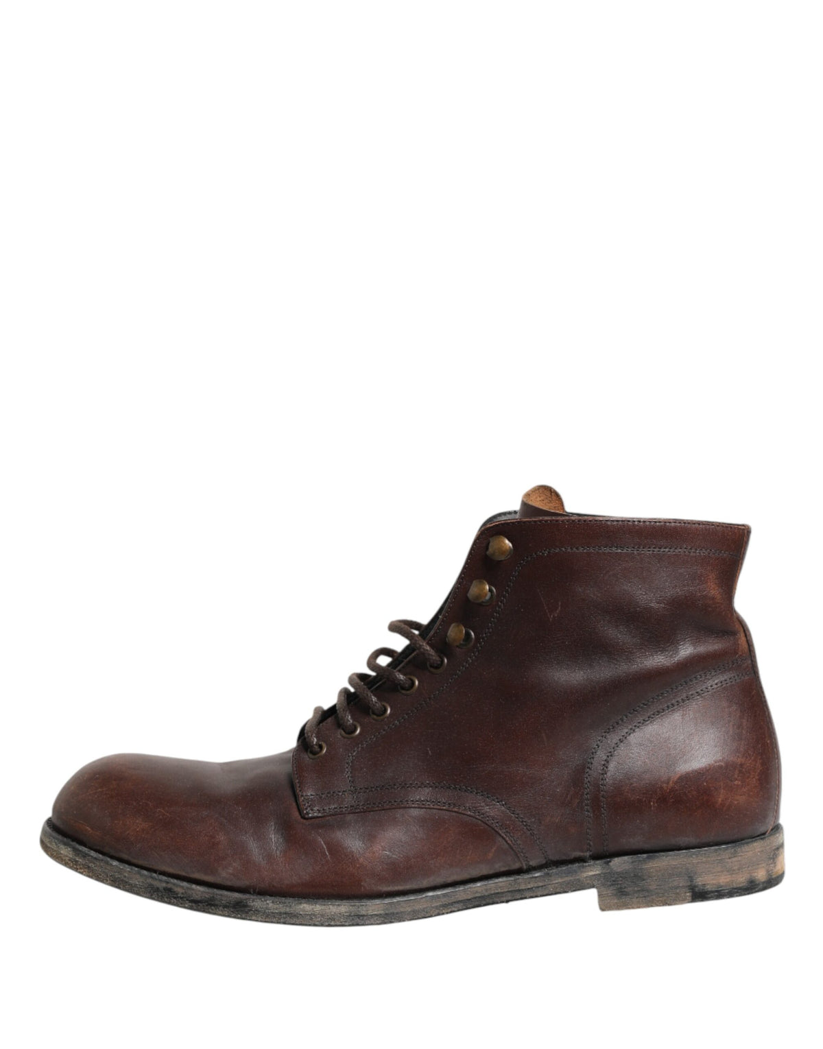 Indulge in the exquisite Dolce & Gabbana Brown Lace Up Short Ankle Boots, crafted from premium leather in Italy, embodying timeless elegance for the discerning individual.