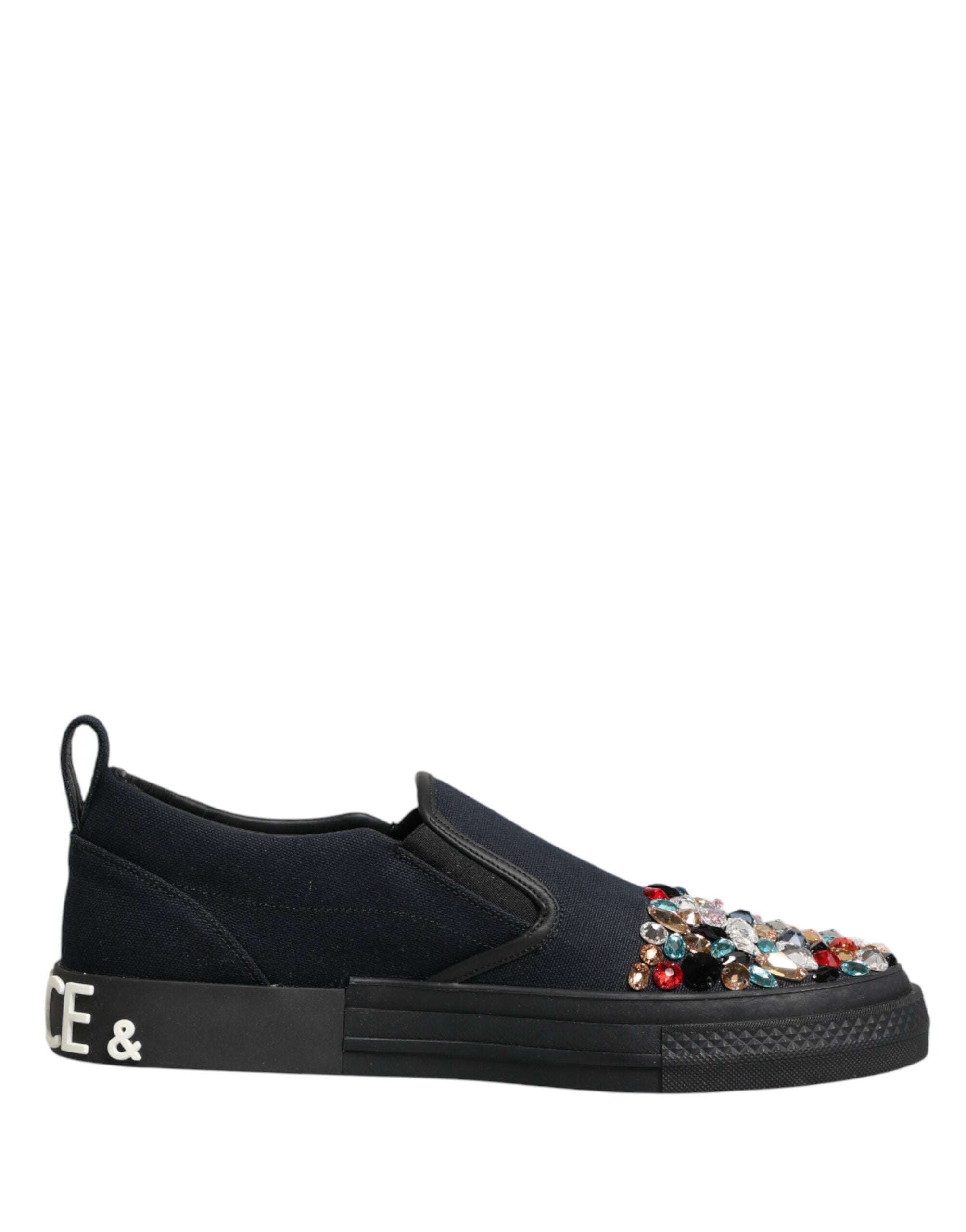 Elevate your style with Dolce & Gabbana's Blue Canvas Embellished Slip On Sneakers, where Italian craftsmanship meets opulent design for the discerning fashion lover.
