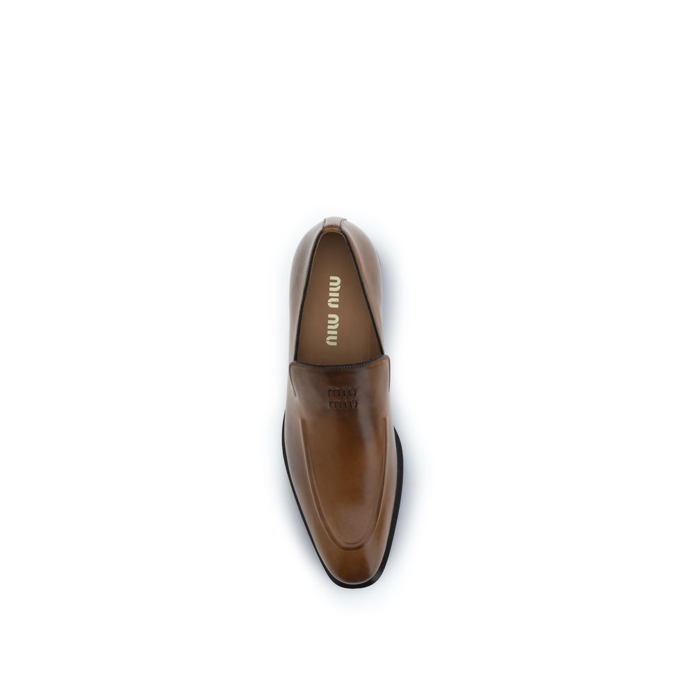 Miu Miu Bos Taurus Slip-On Loafers - Exquisite Calfskin Elegance