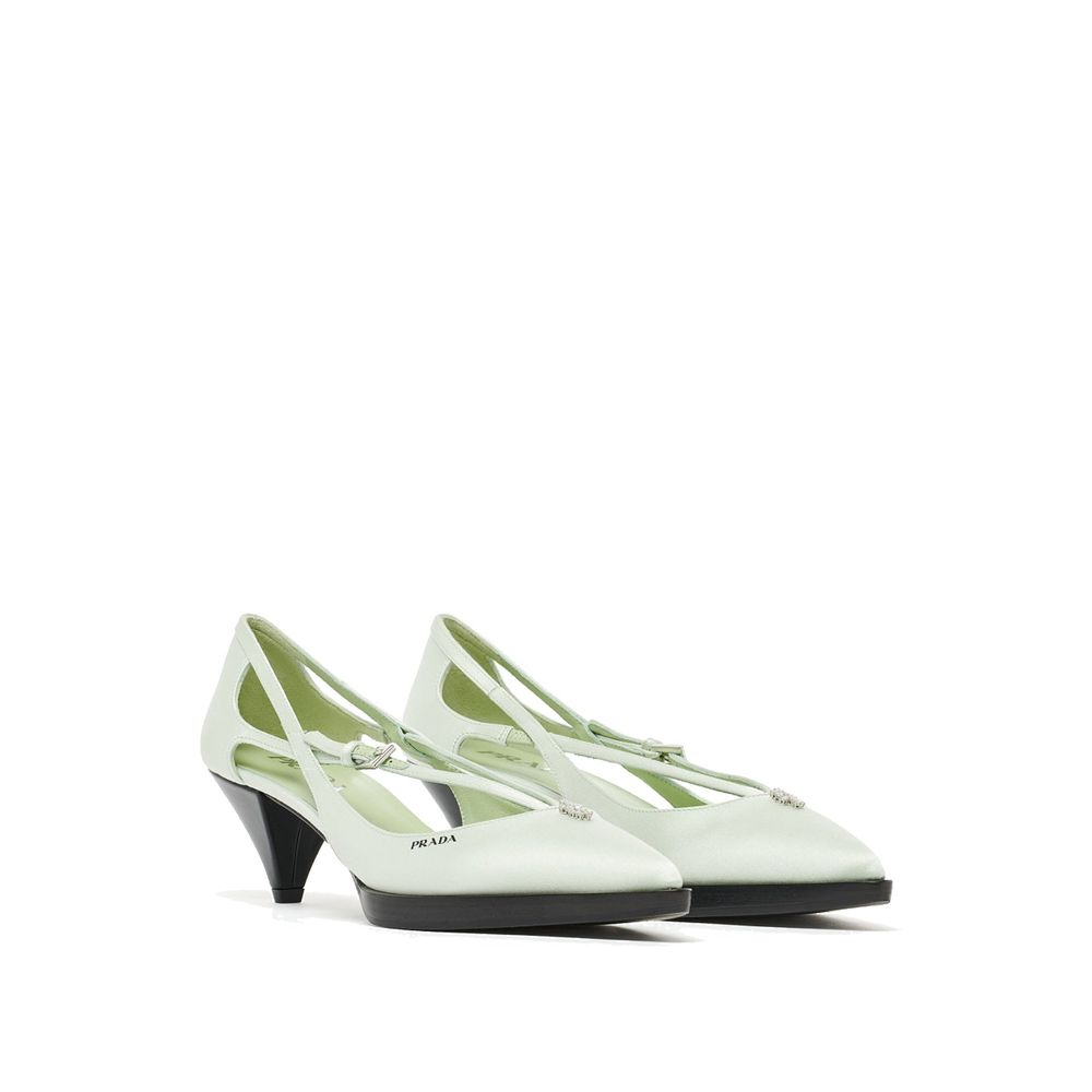 Experience the allure of Prada Bicolor Silk Mid Heel Pumps, crafted from sumptuous silk and adorned with jeweled elegance, embodying timeless sophistication for every occasion.