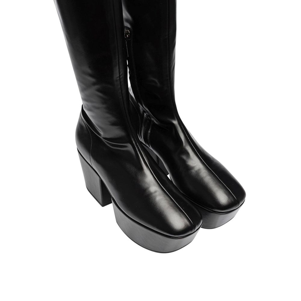 Step into elegance with Prada Black Calfskin Over The Knee boots, crafted from luxurious calf leather, embodying sophistication and timeless allure for every occasion.
