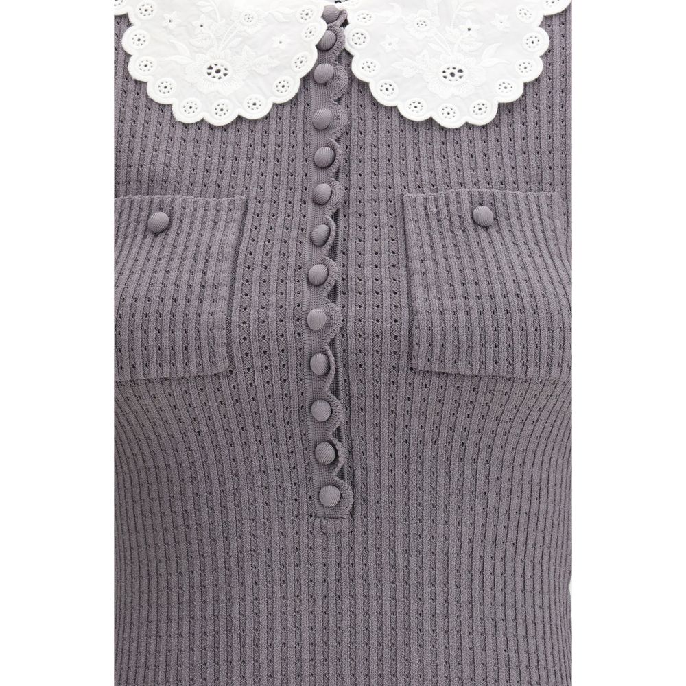 Elevate your style with the Self-Portrait Gray Viscose Shirt, a stunning blend of romantic charm and contemporary elegance, crafted for the discerning individual.