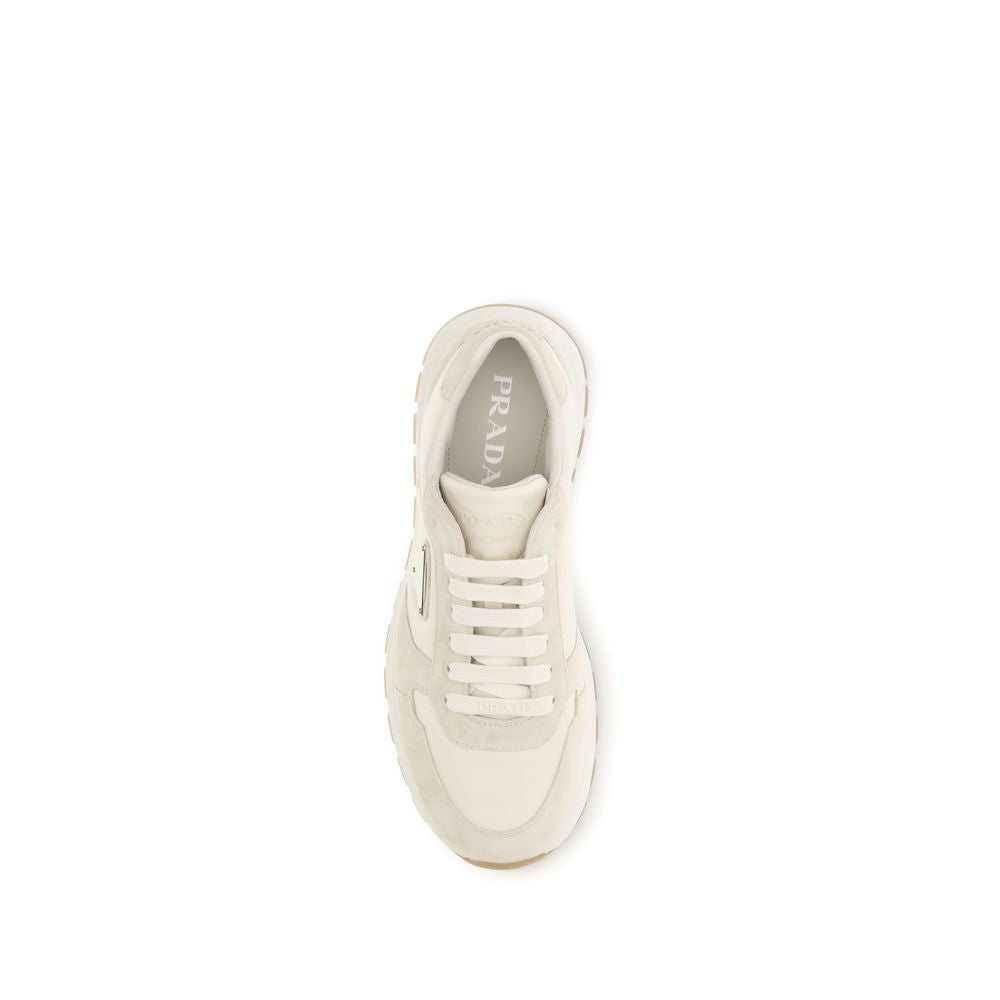 Step into sophistication with Prada Beige Nylon Low Top Sneakers, where luxurious Re-Nylon and suede redefine elegance for every occasion.