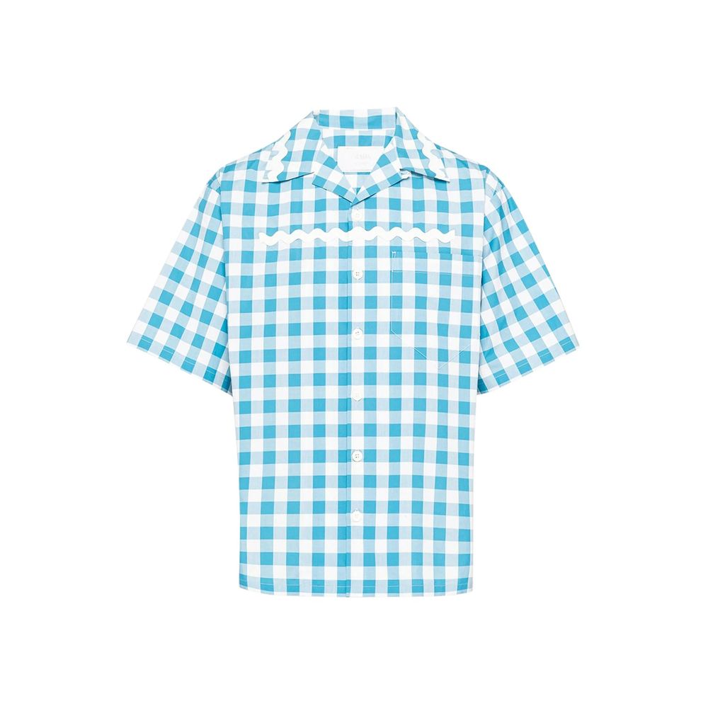 Elevate your wardrobe with the Prada Blue Cotton Pattern Shirt, a masterpiece of Italian craftsmanship, blending sophistication and comfort for the discerning individual.