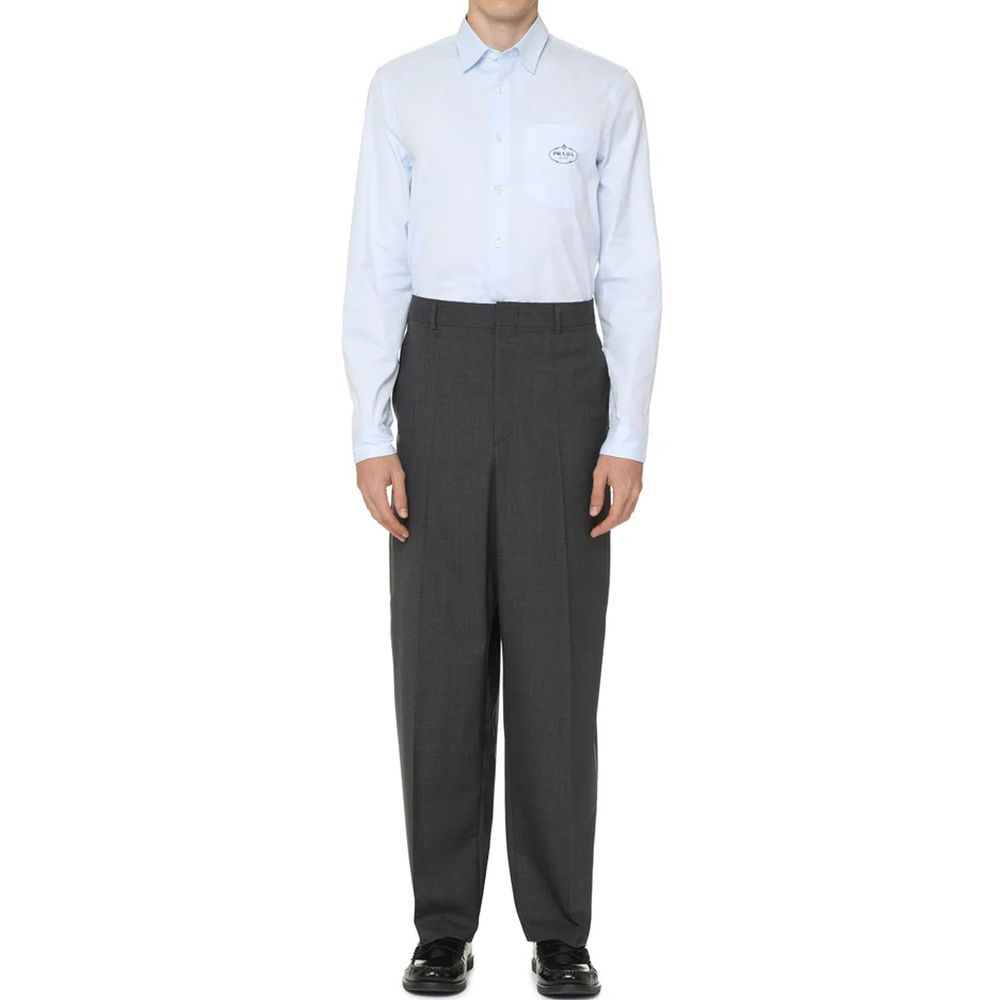 Elevate your style with the Prada Blue Cotton Dress Shirt, a masterpiece of Italian craftsmanship in luxurious cotton, perfect for sophisticated occasions.