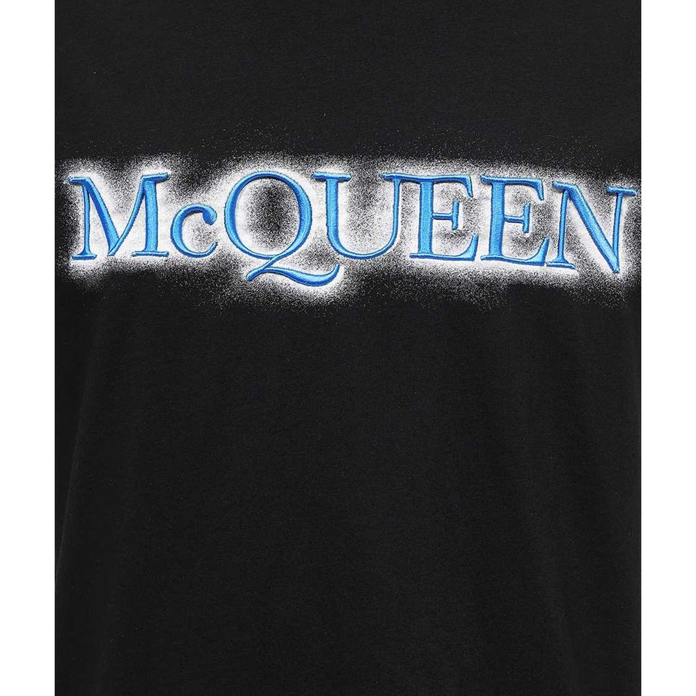 Indulge in the exquisite Alexander McQueen Black Cotton T-Shirt, a timeless masterpiece of Italian craftsmanship that elevates your style with effortless sophistication.