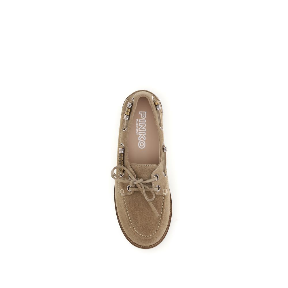 Elevate your style with PINKO's Beige Calf Leather Bos Taurus Slip-On Loafers, where exquisite craftsmanship meets timeless elegance for the discerning individual.