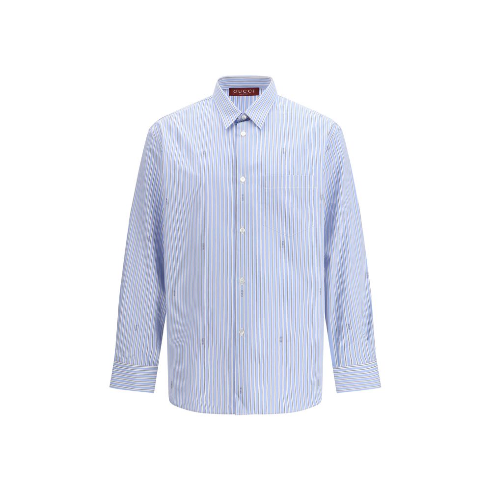 Discover the Gucci Light Blue Cotton Pattern Shirt, a timeless piece crafted from luxurious certified cotton, embodying elegance and sophistication for every occasion.