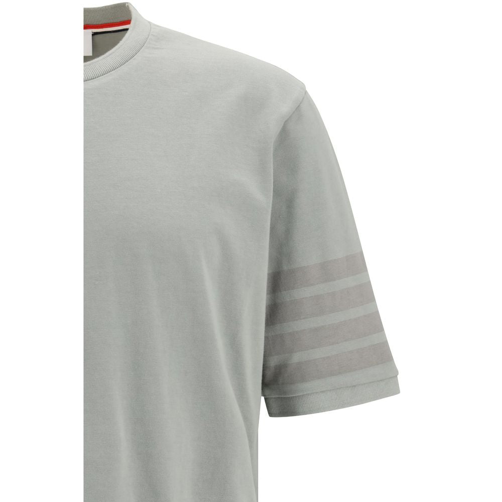 Indulge in the exquisite luxury of Thom Browne Gray Cotton Sportswear, crafted from 100% cotton, embodying timeless elegance and unparalleled craftsmanship for the discerning fashionista.