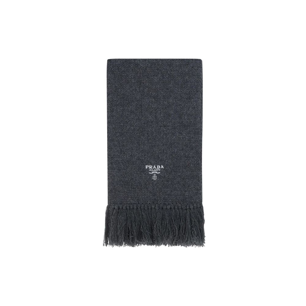 Experience the allure of the Prada Gray Cashmere Scarf, a symbol of sophistication and timeless elegance, meticulously crafted in Italy from the finest cashmere.
