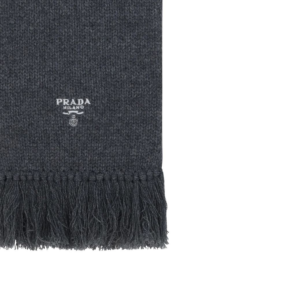 Elevate your style with the Prada Gray Cashmere Scarf, a luxurious blend of Italian craftsmanship and timeless elegance, perfect for the discerning individual.